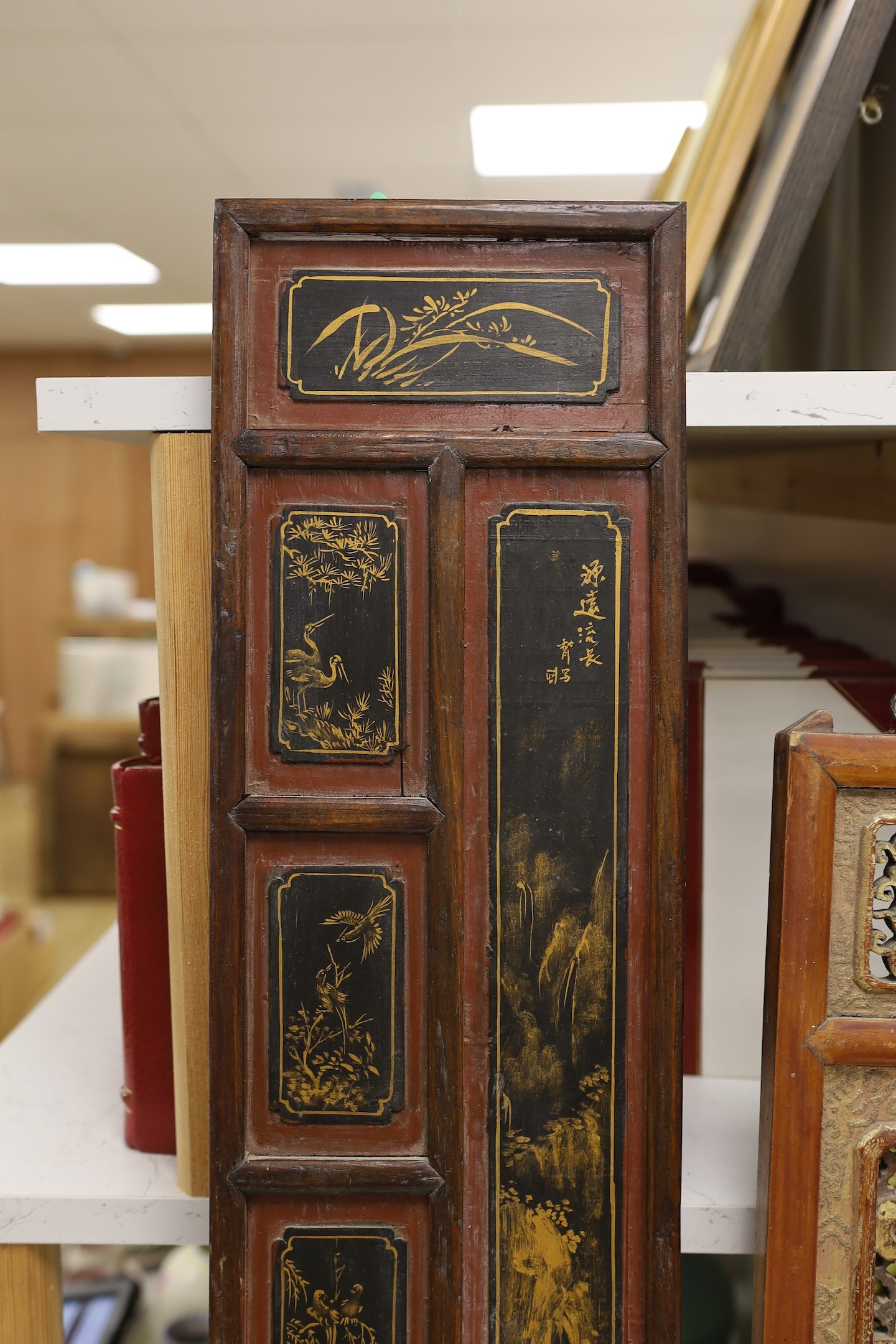 A pair of late 19th century Chinese gilt-decorated lacquer panels and a similar smaller rectangular pierced panel, tallest 91cms high